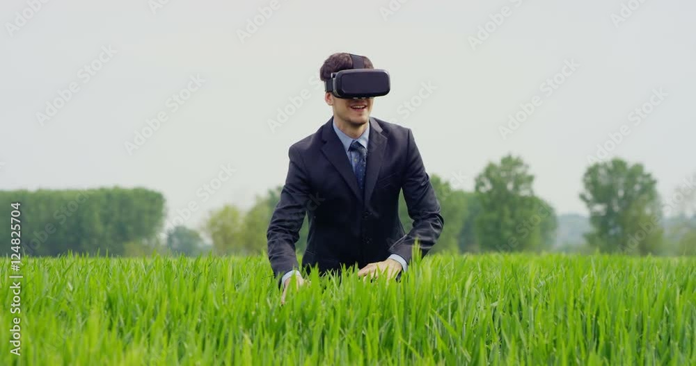 A boy uses the oculus and augmented reality interface traveling in 3D graphics. A virtual trip but real, innovative technology, Concept: technology, oculus, augmented reality and hologram. A boy uses the oculus and augmented reality interface traveling in 3D graphics. A virtual trip but real, innovative technology, Concept: technology, oculus, augmented reality and hologram.
