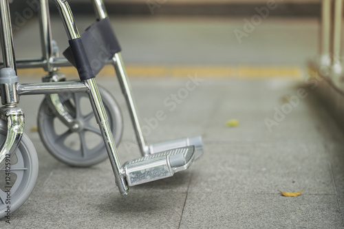 Empty wheelchair parked in hospital