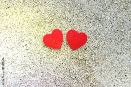 Love Concept  two hearts shaped on the sand. Valentine concept.