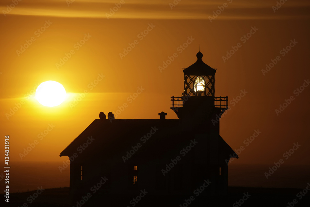 lighthouse silhouette n sun