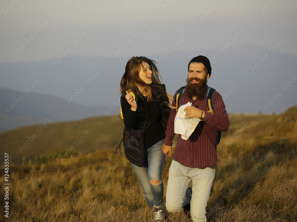 Couple smiling running on mountain Couple smiling running on mountain