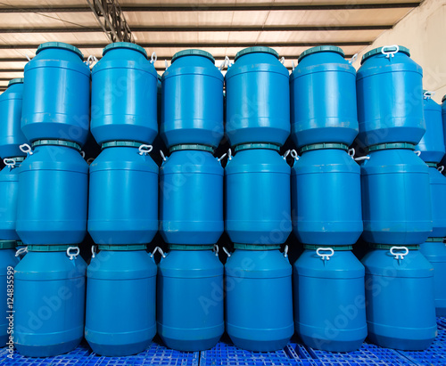 Blue Plastic barrels contain