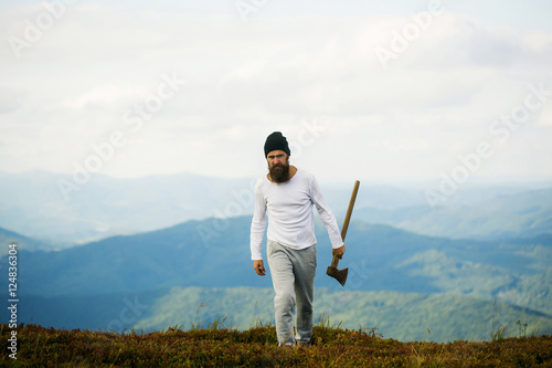 Handsome bearded man with axe