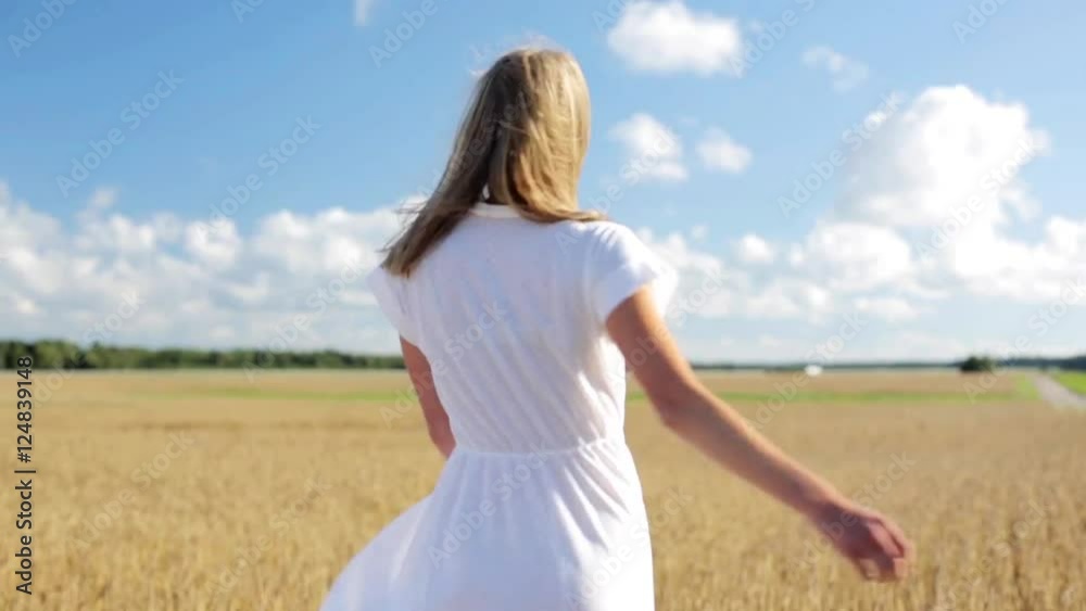 smiling young woman in white dress on cereal field smiling young woman in white dress on cereal field