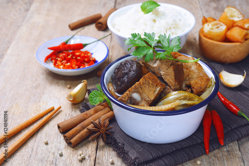 malaysian bak kut teh stew of pork with chinese herb soup. photo