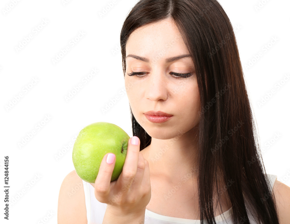 Portrait of young woman eating green apple isolated on white Portrait of young woman eating green apple isolated on white