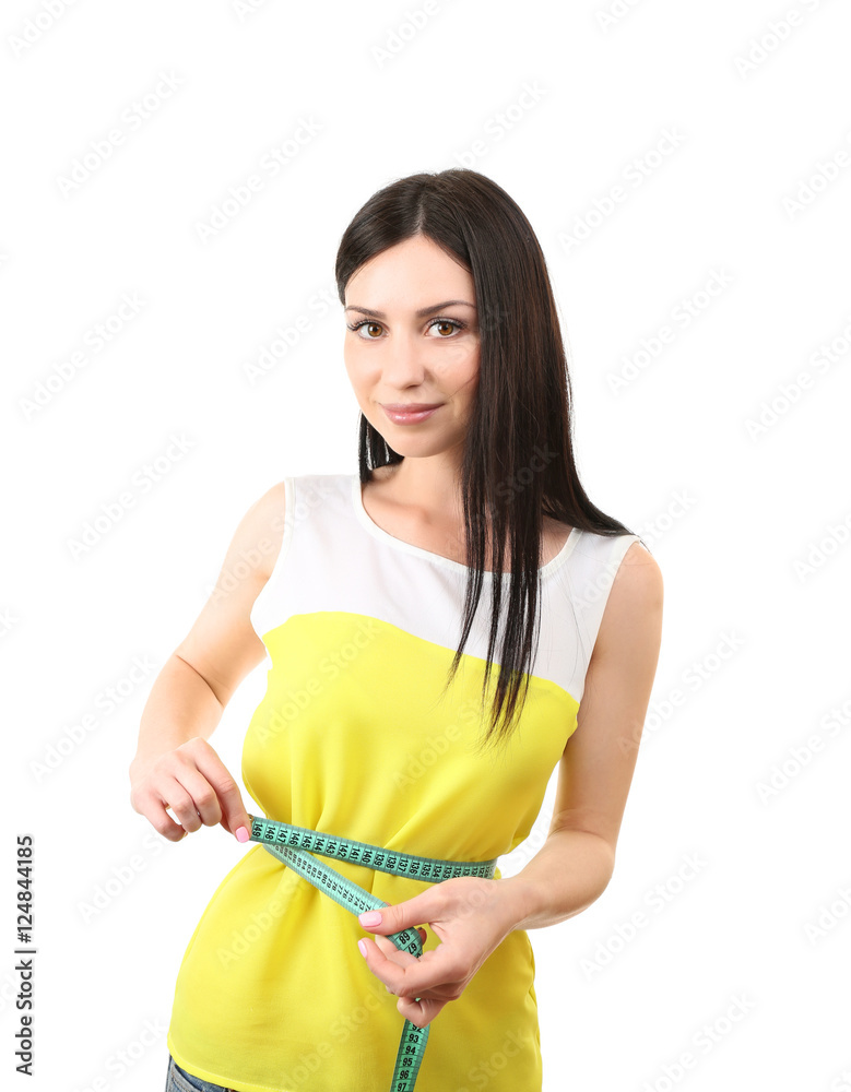 Healthy young woman measuring her waist isolated on white Healthy young woman measuring her waist isolated on white