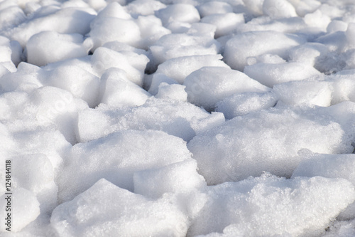Lumps of snow and ice frazil on the surface of the freezing rive