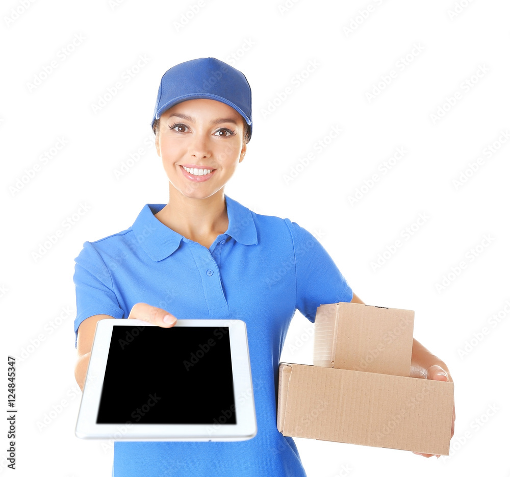 Delivery woman in uniform with tablet and parcels on white background Delivery woman in uniform with tablet and parcels on white background