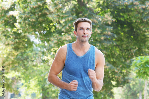 Young sportsman running in the street