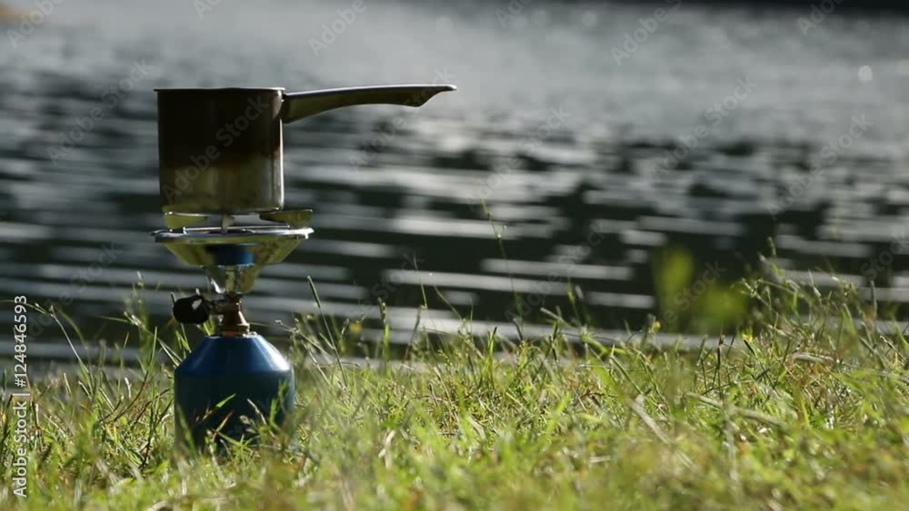 Camp gas bottle in campsite near to the lake Camp gas bottle in campsite near to the lake