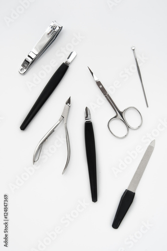 manicure instruments set on white background top view