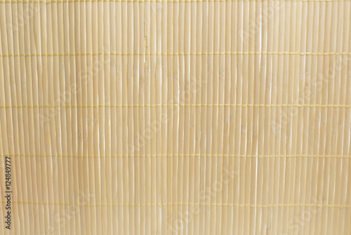 Brown bamboo mat on white kitchen table background