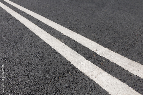 double white line diagonally across the road