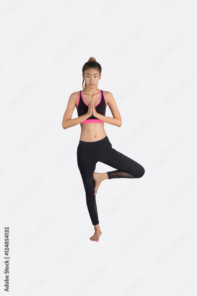 Young woman in yoga pose.
