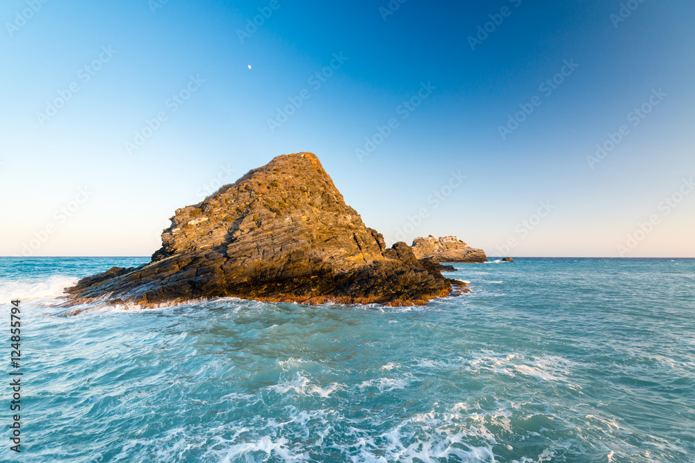 A view of a group of emerging rocks close to a mediterranean spanish beach (San Cristobal beach) at Almunecar, Granada, Spain