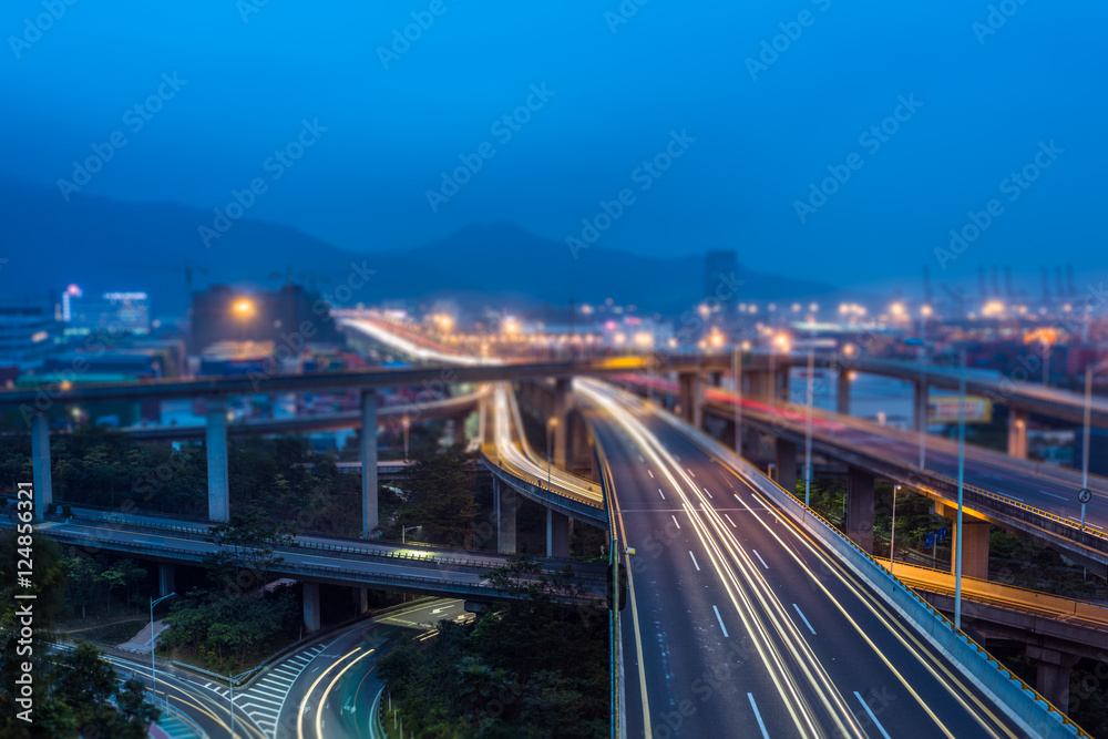 Chongqing City.City skyline and busy highway system at night.