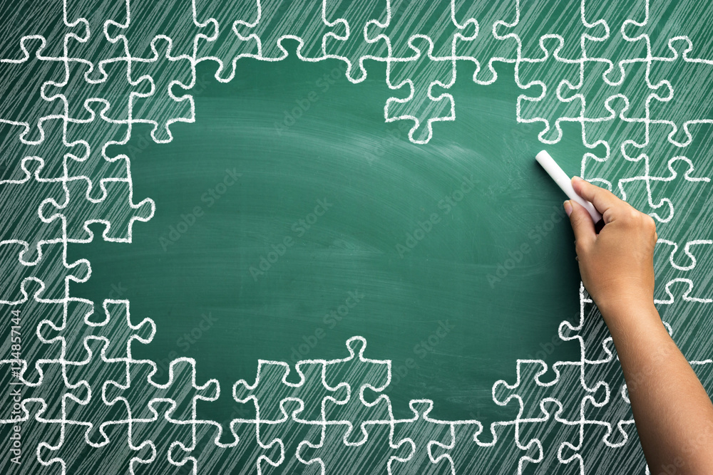 Puzzle pieces on chalkboard with empty space for text Puzzle pieces on chalkboard with empty space for text
