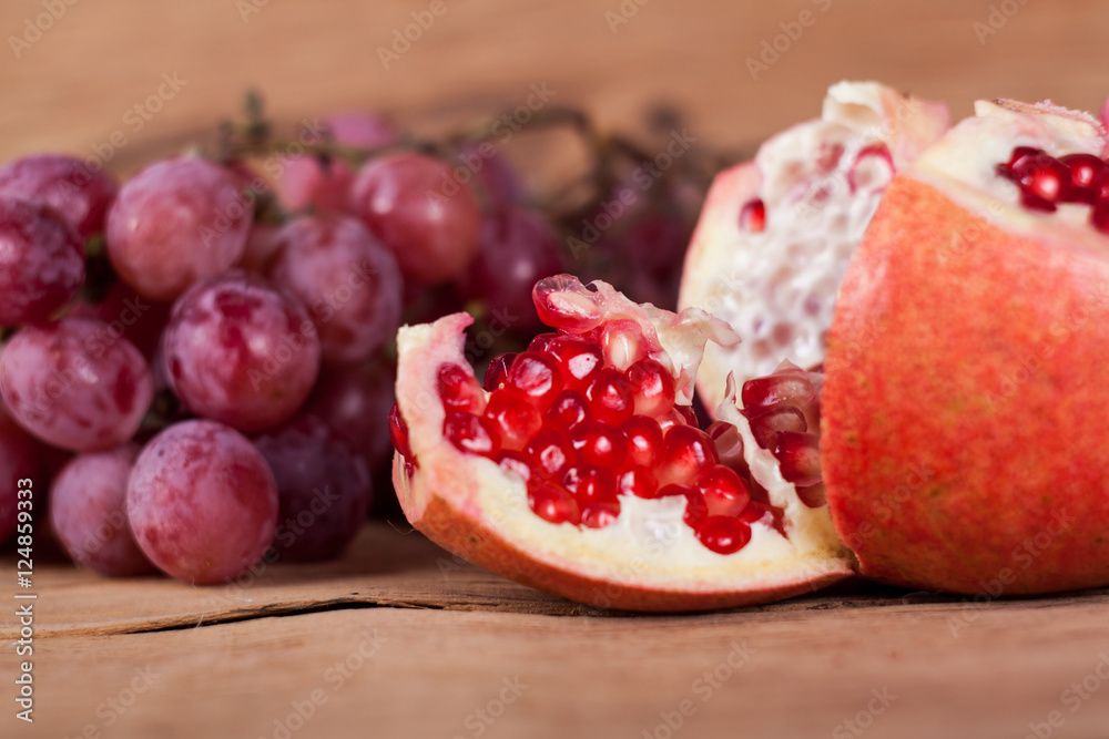 Ripe red grapes and pomegranate Ripe red grapes and pomegranate