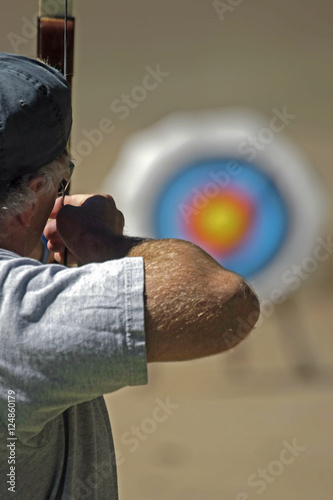 man w archery bow n arrow