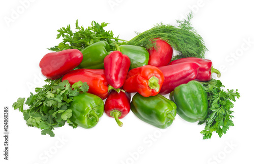 Green and red bell peppers and bundles of greens