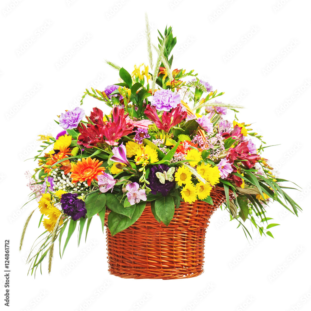 Fototapeta premium Flower bouquet arrangement centerpiece in wicker basket isolated on white background. Closeup.