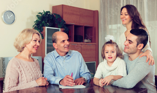 Photography family ready to sign banking documents
