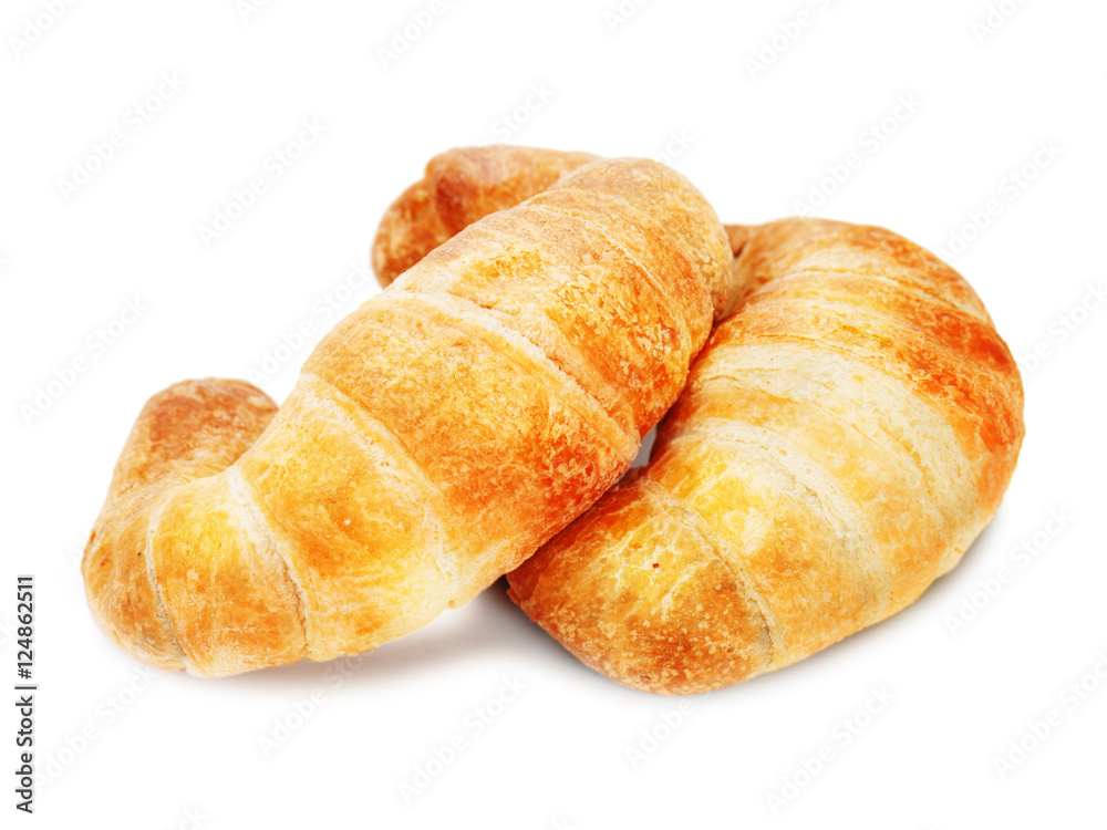 Fresh and tasty croissant isolated on white background. Closeup. Fresh and tasty croissant isolated on white background. Closeup.