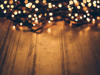 christmas fairy lights on a wooden table,studio shot.