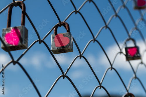 love locked,rusty lock on fence.
