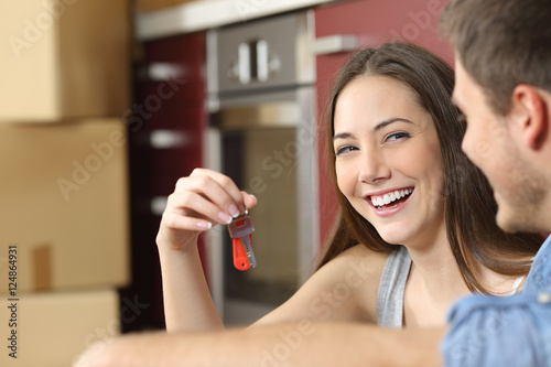 Happy new flat owners showing keys