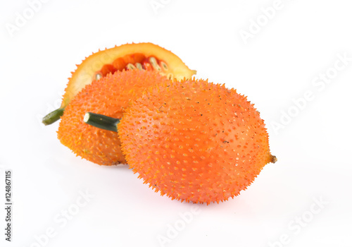 Gac fruit slices isolated on white background photo