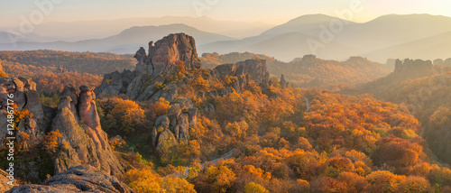 Belogradchik rocks at sunset / Magnificent panoramic sunset view of the Belogradchik rocks in Bulgaria, lit by the last rays of autumn sun