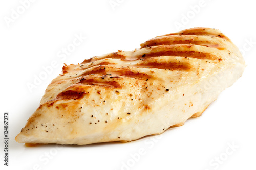  Whole grilled chicken breast with black pepper isolated on white.