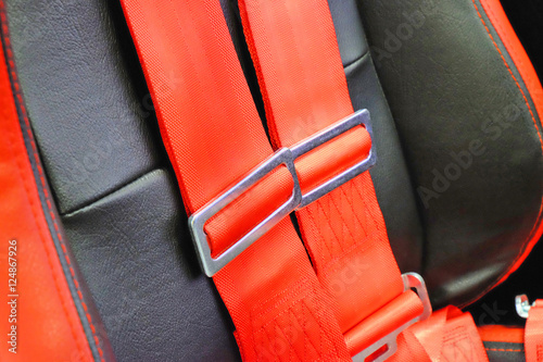 red belts with buckle for a sports car
