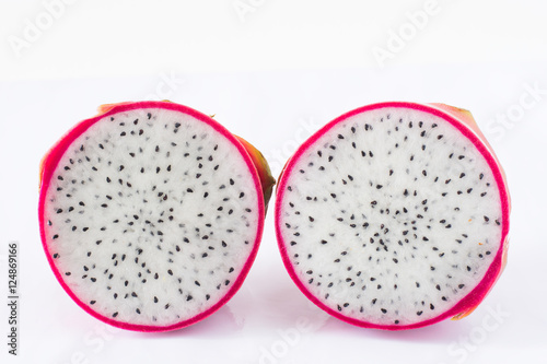Dragon fruit cut in half on white background