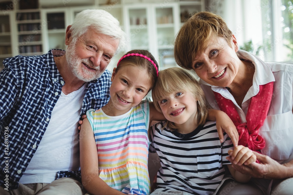 Portrait of grandparents sitting with their grandchildren Portrait of grandparents sitting with their grandchildren