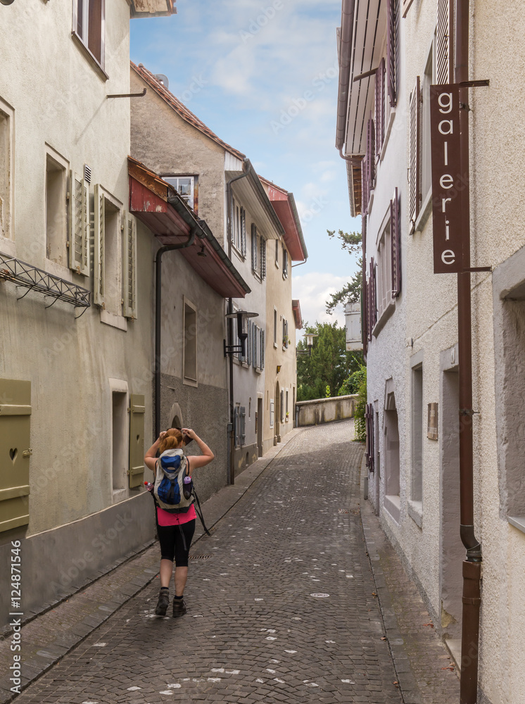 Traveler walking down narrow street