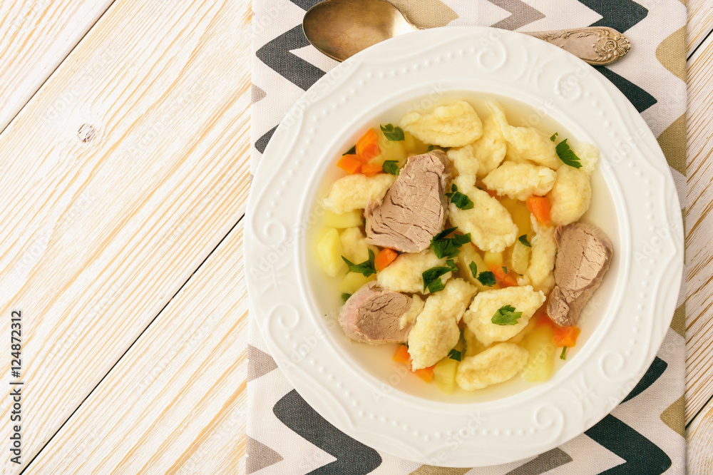 Meat soup with dumplings on white background. Meat soup with dumplings on white background.