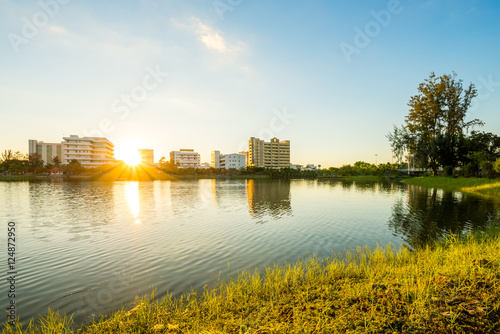 Lake in city park with skyline in background