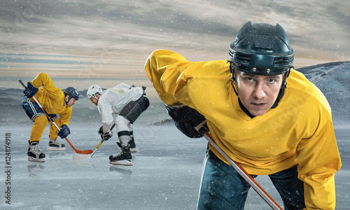 Photography Ice hockey player on the ice in mountains