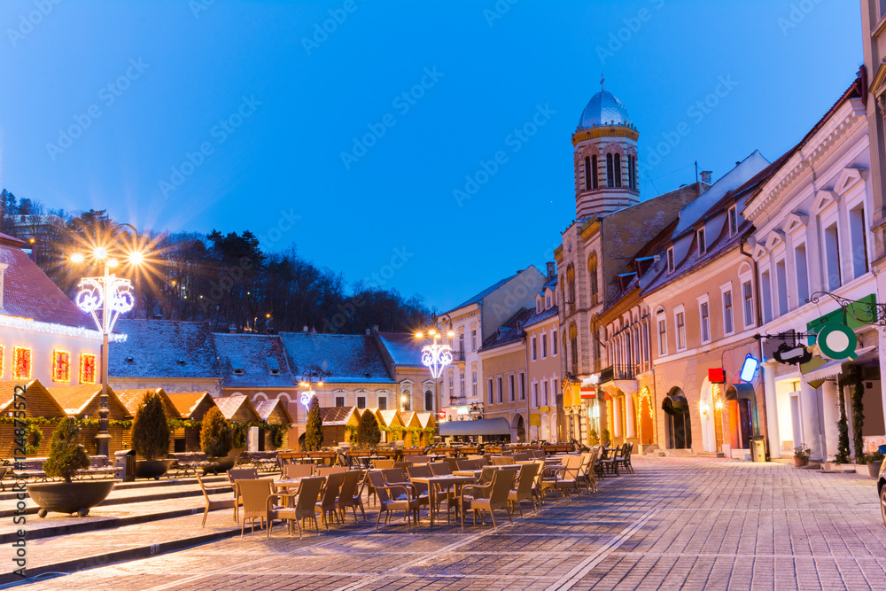 Beautiful architecture of Brasov town illuminated in evening light, Christmas time, Romania