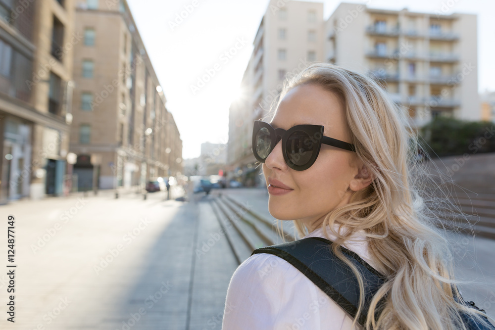 Pretty young woman traveler enjoying her travel in Europe