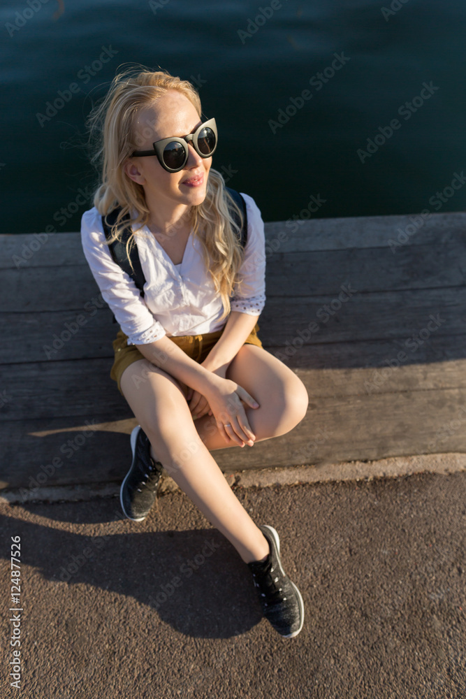 Portrait of a Stylish Pretty Young Woman traveling throug city Portrait of a Stylish Pretty Young Woman traveling throug city
