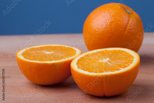Half cut Orange on wooden table