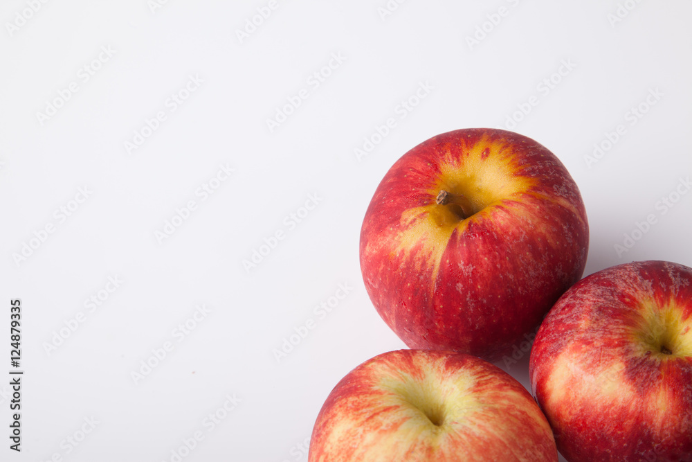 Three red apples