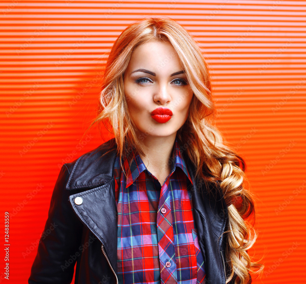 Fashion portrait beautiful young blonde woman blowing red lips m