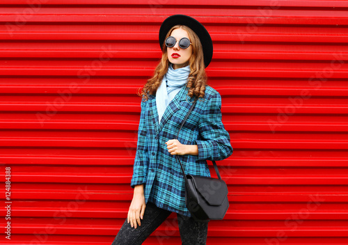 Fashion pretty young woman model wearing black hat coat jacket w