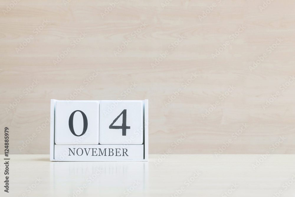 Closeup surface white wooden calendar with black 2 november word Closeup surface white wooden calendar with black 2 november word