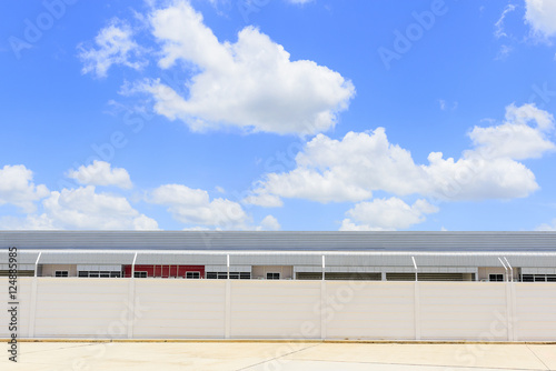 The factory building with the sky and cloud in midday scene